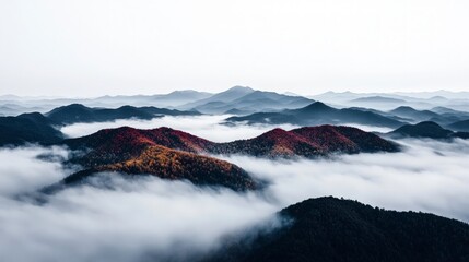 Fototapeta premium Autumnal Mountain Range Misty Peaks Colorful Foliage Aerial View
