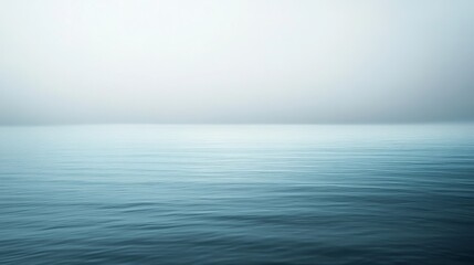 Obraz premium A calm sea merges with a serene sky at the horizon, capturing the essence of peaceful isolation and expansive tranquility.