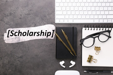 Naklejka premium Scholarship. Flat lay composition with different office stationery on dark grey table
