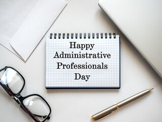 Happy Administrative Professionals Day. Notepad with congratulatory inscriptions. Close-up, view...