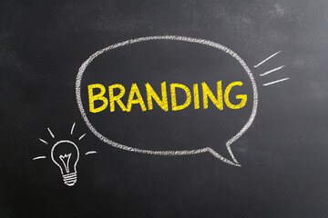 Chalkboard art: "Branding" inside speech bubble, with a lightbulb, symbolizing creative ideas and the concept of building a strong identity.