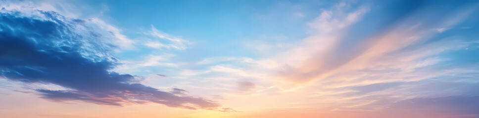 Obraz premium Panoramic sky with beautiful clouds at sunset, featuring blue and orange colors