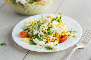 Chinese cabbage salad with squid, eggs, tomatoes and other vegetables