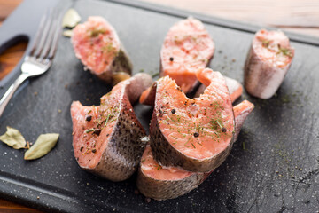 Salmon steaks with herbs and black pepper