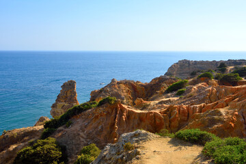 walking path with breathtaking views through the coast from porches to benagil caves lagoa algarve portugal