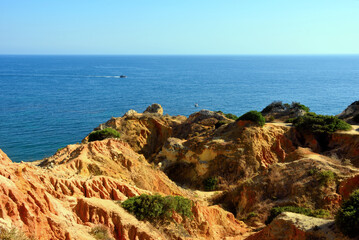 walking path with breathtaking views through the coast from porches to benagil caves lagoa algarve portugal