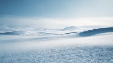 Obraz premium Endless snow dunes roll beneath a soft sky, capturing the elegance and simplicity of a serene winter landscape.