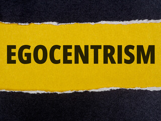 Egocentrism text title on torn paper background