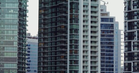 Fototapeta premium Glass skyscrapers in the office center of a modern city. Overview of house facades