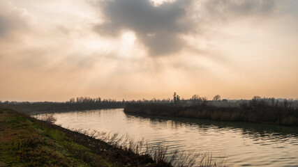 Fototapeta premium the river Po inside its Veneto side Delta during a winter season, Rovigo, Italy