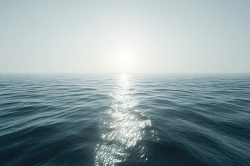 Obraz premium Serene ocean scene with sun reflecting on calm waters, creating a peaceful and tranquil atmosphere.