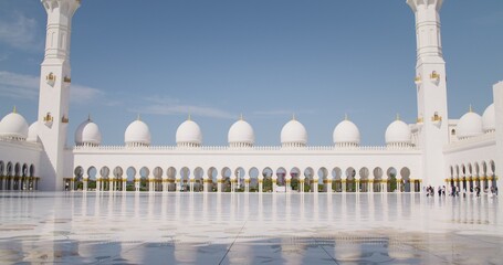 Columns and arches at the entrance to the mosque in Abu Dhabi, UAE, view from the courtyard