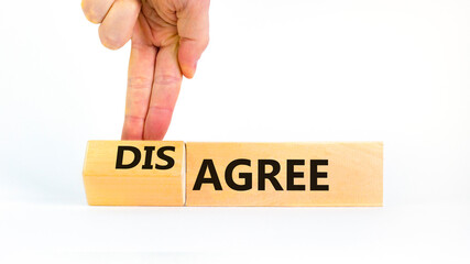 Agree or disagree symbol. Concept words Agree Disagree on beautiful wooden blocks. Beautiful white table white background. Businessman hand. Business agree or disagree concept. Copy space