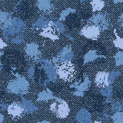 Seamless denim pattern with paint splatter, stains, blots, smudge of paint. Textured background. For apparel, fabric, textile, surface design.