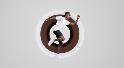 Young African American guy with athletic build captured in mid-air, exemplifying dynamics and...