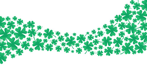 Festive wave of green clovers. Arrangement of shamrocks in varying sizes isolated on transparent background. St. Patrick's Day.