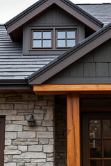 Modern House Exterior Design: Stone, Wood, and Gray Roof. Luxury Home Architecture and Real Estate