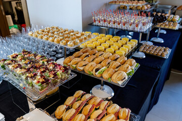 catering table with food, snacks and desserts
