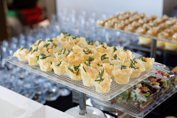 catering table with food, snacks and desserts