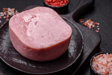 Delicious canned pink ham with salt, spices and herbs