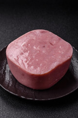 Delicious canned pink ham with salt, spices and herbs