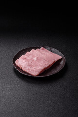 Delicious canned pink ham with salt, spices and herbs