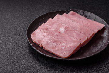 Delicious canned pink ham with salt, spices and herbs