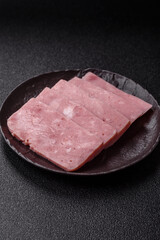 Delicious canned pink ham with salt, spices and herbs