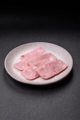 Delicious canned pink ham with salt, spices and herbs