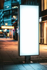 Illuminated advertising display urban street photography nighttime close-up marketing concept