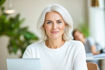 Middle-aged woman explaining financial strategies during online training session in a cozy co-working space
