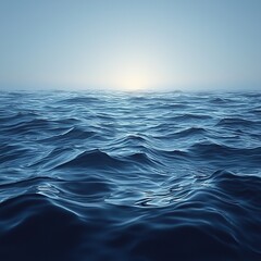 Fototapeta premium Calm ocean waters reflect the early morning light at dawn over the horizon