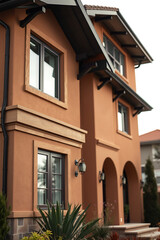 Fototapeta premium Luxury Home Exterior: Modern Architectural Design and Landscaping. This stunning property features a contemporary facade, beautiful landscaping, and high-end finishes.