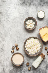 Dairy products on white grunge background, top view, flat lay, vertical