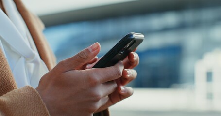 African american woman chatting on mobile phone outdoors, close-up