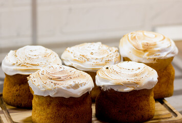 Easter cakes with powdered sugar on a grey background