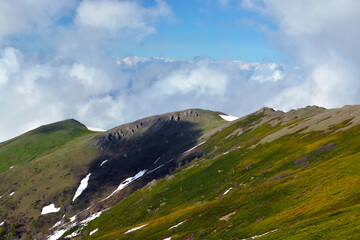 High in the mountains at the level of clouds and alpine meadows
