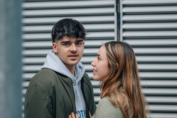 young couple on the street in intimate or affectionate attitude