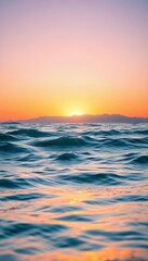 Fototapeta premium Serene Sunset Over Ocean Waves, A Peaceful Coastal View