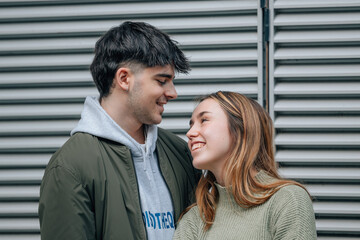 young couple on the street in intimate or affectionate attitude