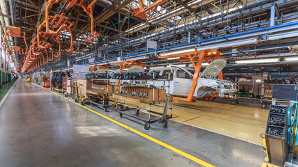 Fototapeta premium Conveyor assembly line of a passenger car.