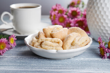 Homemade nut shaped russian soviet cookies and wafer rolls with pastry cream.
