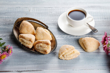 Homemade nut shaped russian soviet cookies and wafer rolls with pastry cream.
