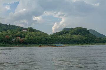 Laos ship cruising along the Mekong River in Luang Prabang