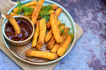  Crispy home made  deep fried   chicken strips . Breaded  with cornflakes chicken  breast fillets  with chilly peppers and fresh   basil on wooden rustic background