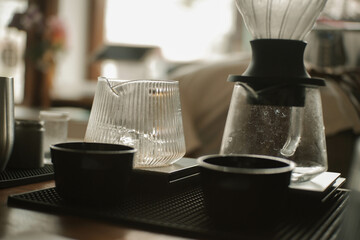 a brewer is brewing Japanese filter coffee