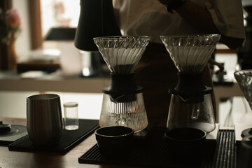 barista brewing filter coffee, manual brew