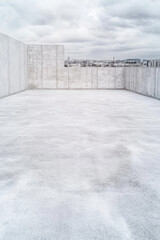 Concrete empty rooftop parking area. Modern infrastructure on new building. Rooftop parking lot.