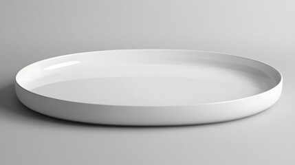 Minimalistic white oval plate on a smooth surface, showcasing simplicity and elegance