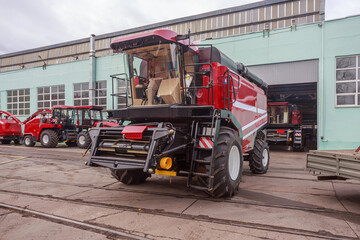 Modern combine for harvesting crops in fields sown with cereals.